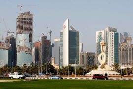 A view shows the Qatar Petroleum headquarters (L), which is under construction, in Doha April 8, 2013. Bankers and politicians touting their countries' wares have to work hard to get the attention of Qatar's sovereign wealth fund, such is the range of its interests, from banks to cars to soccer clubs, and its exacting requirement for returns. With estimated assets of about $200 billion, and more than a dozen potential deals on its radar every week, the state-run firm has no time for less than compelling investment opportunities and hopes to make more than 17 percent on its book this year, according to one banker close to the fund. Picture taken April 8, 2013. To match story QATAR-FUND/ REUTERS/Fadi Al-Assaad (QATAR - Tags: CITYSCAPE BUSINESS)