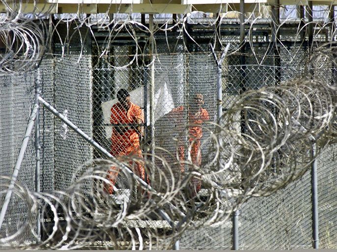 epa03682731 (FILE) A file photograph showing men dressed in orange coveralls, alleged al-Qaida and Taliban combatants captured in Afghanistan washing before midday prayers at controversial Camp X-Ray, where they are being held in cages at the US Naval Base at Guantanamo Bay, Cuba, 27 January 2002. Reports state on 30 April 2013 that US President Barack Obama said he would again move to close the military prison at Guantanamo Bay, Cuba and noted that the United States needs to reevaluate how it handles suspected terrorists. Obama had campaigned in 2008 on closing the prison camp, but had stepped back from doing so amid strong opposition from Congress. EPA/J. SCOTT APPLEWHITE / POOL