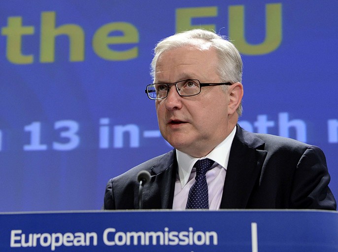 European Union Commissioner for Economic and Monetary Affairs Olli Rehn talks to the media during a press conference at the EU Commission headquarter in Brussels, on April 10, 2013. The European Commission warned Wednesday that Spain and Slovenia pose the biggest economic risks at present and must quickly tackle excessive imbalances, giving them just weeks to show they can deliver the changes needed. AFP Photo/Thierry Charlier