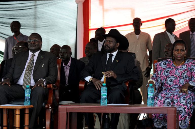 Caption:South Sudan's President Salva Kiir (C) with his wife Ayendit (R) and South Sudan's Vice President Riek Machar (L) listen during the announcement of the results of the voting in Sudan, January 30, 2011. South Sudan overwhelmingly voted to split from the north in a referendum intended to end decades of civil war, officials said on Sunday, sparking mass celebrations in the southern capital Juba.