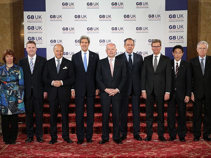 G8 Foreign Ministers (L-R) EU foreign policy chief Catherine Ashton, Canadian Foreign Affairs Minister John Baird, French Foreign Minister Laurent Fabius, US Secretary of State John Kerry, British Foreign Secretary William Hague, Russian Foreign Minister Sergei Lavrov, German Foreign Minister Guido Westerwelle, Japanese Foreign Minister Fumio Kishida and Italian Prime Minister Mario Monti pose for a photograph before the G8 Foreign Ministers Meeting at Lancaster House in central London April 11, 2013. REUTERS/Peter Macdiarmid/Pool (BRITAIN - Tags: POLITICS)