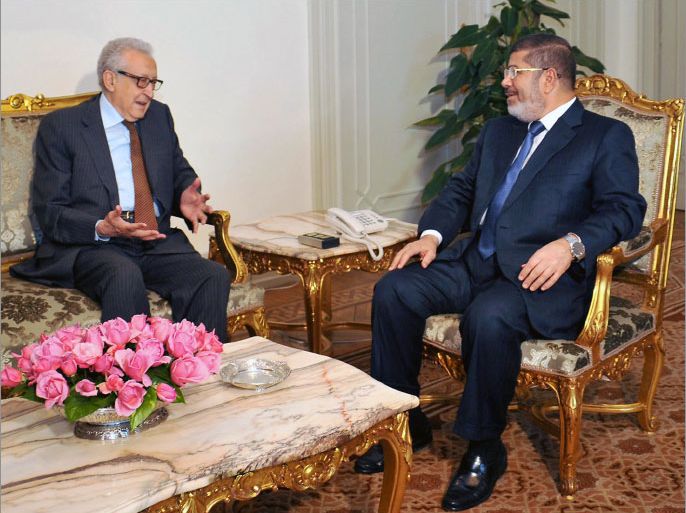 A handout picture released by the Egyptian Presidency shows Egypt's President Mohamed Morsi (R) meeting with United Nations-Arab League envoy Lakhdar Brahimi in Cairo on April 14, 2013. AFP PHOTO / HO / EGYPTIAN PRESIDENCY == RESTRICTED TO EDITORIAL USE - MANDATORY CREDIT "AFP PHOTO / HO / EGYPTIAN PRESIDENCY" - NO MARKETING NO ADVERTISING CAMPAIGNS - DISTRIBUTED AS A SERVICE TO CLIENTS ==