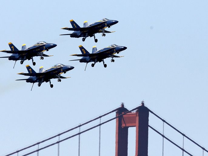 U.S. Navy Blue Angels F/A-18 Hornets pass the Golden Gate Bridge during a practice session for San Francisco Fleet Week in San Francisco, California 05 October 2007