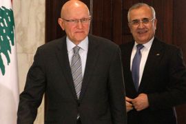 Newly elected Lebanese Prime Minister Tammam Salam (L) walks with Lebanon's President Michel Suleiman at the presidential palace in Baabda, near Beirut April 6, 2013. Lebanon's president formally asked Sunni Muslim politician Tammam Salam to form a new government on Saturday after Salam