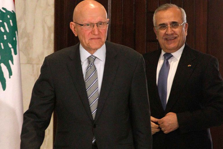 Newly elected Lebanese Prime Minister Tammam Salam (L) walks with Lebanon's President Michel Suleiman at the presidential palace in Baabda, near Beirut April 6, 2013. Lebanon's president formally asked Sunni Muslim politician Tammam Salam to form a new government on Saturday after Salam