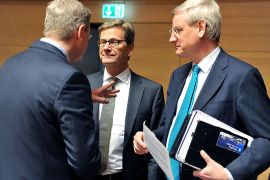 EU Commissioner for Enlargement and European Neighbourhood Policy Stefan Füle, German Foreign Affairs minister Guido Westerwelle and Swedish Foreign Affairs minister Carl Bildt (LtR) talk prior to a Foreign Affairs Council on April 22, 2013 at the Kirchberg conference centre in Luxembourg. EU foreign ministers meeting are set to formally adopt measures enabling EU companies on a case-by-case basis to import Syrian crude and export oil production technology and investment cash to areas in the hands of the opposition. The Council will take stock of the reparations for the Eastern Partnership foreign ministers meeting, which will take place in July in Brussels. The Council will also look at the situation in Mali. AFP PHOTO /GEORGES GOBET