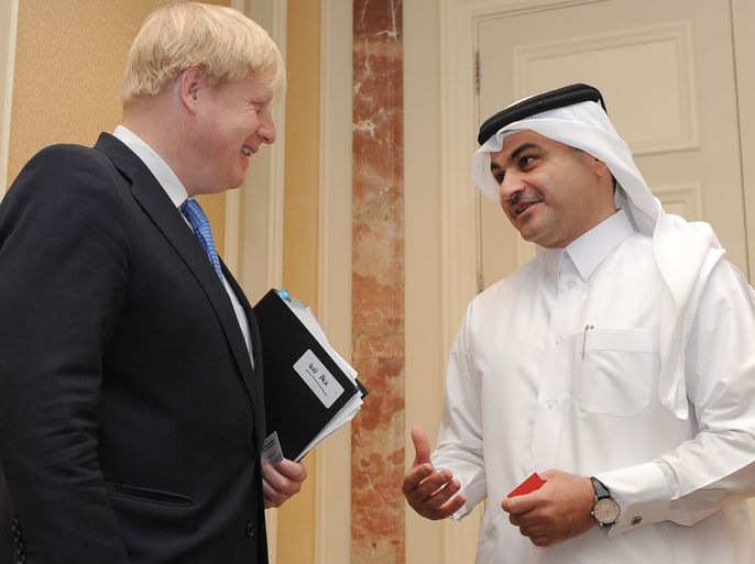 epa03669726 Boris Johnson (L) the Mayor of London talks with Nasser Ali Al Mawlawi, President of Qatar Public Works Authority (Ashghal) after the launch of institute for infrastructure studies at Four Seasons Hotel in Doha-Qatar on 20 April 2013. Reports state that the Mayor of London, Boris Johnson, is leading a trade mission to the Gulf seeking to attract major investment to London and build stronger ties with this high growth region. EPA/STR