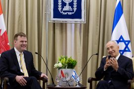 epa03655335 Israeli President Shimon Peres (R) meets Canadian Foreign Minister John Baird (L) at the Israeli President's residence in Jerusalem, Israel, 09 April 2013. Media reports state that John Baird stated that Canada remains committed to a two-state solution to the Israel-Palestinian matter, one reached through a negotiated agreement that guarantees Israel?s right to live in peace and security and leads to the establishment of a Palestinian state. EPA/ABIR SULTAN