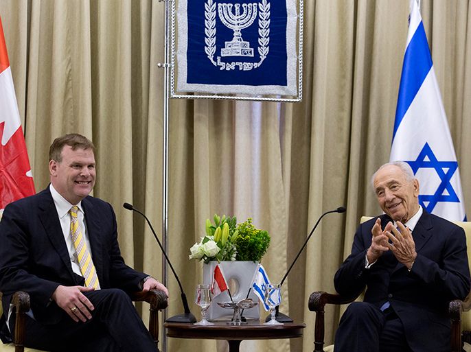 epa03655335 Israeli President Shimon Peres (R) meets Canadian Foreign Minister John Baird (L) at the Israeli President's residence in Jerusalem, Israel, 09 April 2013. Media reports state that John Baird stated that Canada remains committed to a two-state solution to the Israel-Palestinian matter, one reached through a negotiated agreement that guarantees Israel?s right to live in peace and security and leads to the establishment of a Palestinian state. EPA/ABIR SULTAN