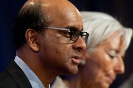 NK040 - Washington, District of Columbia, UNITED STATES : International Monetary and Financial Committere (IMFC) chair Tharman Shanmugaratnam and International Monetary Fund (IMF) Managing Director Christine Lagarde speak at a press conference after the IMFC meeting at the 2013 World Bank/IMF Spring meetings in Washington on April 20, 2013. AFP PHOTO/Nicholas KAMM