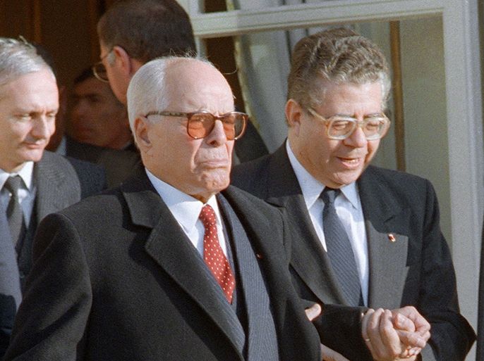 Tunisan President for Life Habib Ben Ali Bourguiba (L) and French President François Mitterrand (R) walk together 23 December 1986 at the steps of Elysée Palace in Paris after their meeting. Bourguiba ruled Tunisia from 1957 until being destituted in 1987 by his Prime minister General Ben Ali, after leading the country to independence from France in 1956. Date Published: September 06, 2012 Credit: AFP/Getty Images
