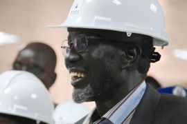 SOUTH SUDAN : South Sudan's Minister for Petroleum and Mining Stephen Dhieu Dau smiles in an oil mining control centre in Thar Jath on April 6, 2013 after restarting oil production. South Sudan restarted oil production on April 6, ending a bitter 15-month row with former civil war foe Sudan and marking a major breakthrough in relations after bloody border clashes last year. AFP PHOTO / HANNAH MCNEISH