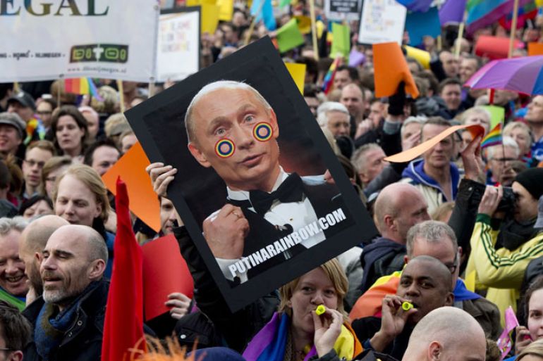Over 1,000 people protest against Russian President Vladimir Putin's visit to Amsterdam on April 8, 2013, with rainbow flags flying at half-mast around the city that prides itself on enjoying every kind of freedom.