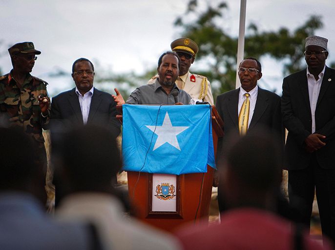 Somali President Hassan Sheikh Mohamud speaks during a military parade marking the 53rd anniversary of the Somali National Army (SNA) in Mogadishu, in this handout photograph taken April 12, 2013 and released by the African Union-United Nations Information Support Team. REUTERS/Stuart Price/AU-UN IST/Handout (SOMALIA - Tags: POLITICS MILITARY ANNIVERSARY)