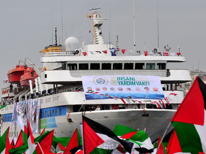 (FILES)-- A file photo taken on December 26, 2010 shows the Turkish ship Mavi Marmara, on which several passengers were killed during a raid by the Israeli navy on May 31,2010, arriving at Istanbul's Sarayburnu port as people wave Turkish and Palestinian flags.