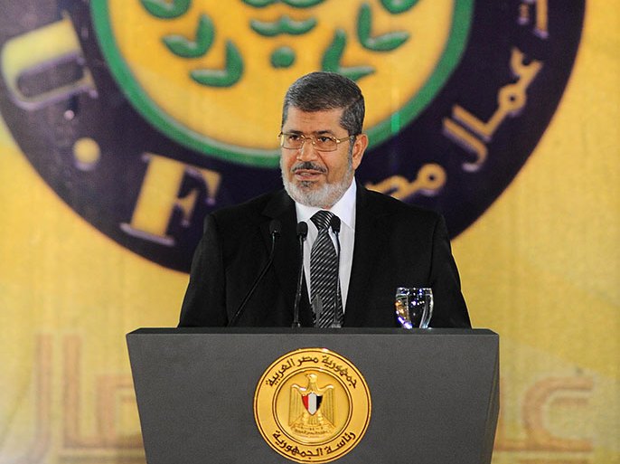 A handout picture released by the Egyptian presidency shows Egyptian President Mohamed Morsi addressing a ceremony marking Labour Day in Cairo on April 30, 2013. AFP PHOTO / HO / EGYPTIAN PRESIDENCY