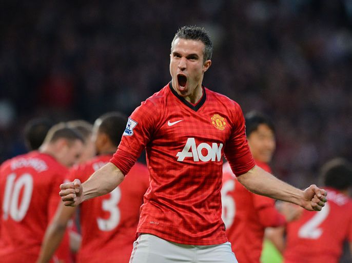 Manchester United's Dutch striker Robin van Persie celebrates scoring his team's first goal against Aston Villa during the English Premier League football match between Manchester United and Aston Villa at Old Trafford in Manchester, northwest England, on April 22, 2013. AFP PHOTO / PAUL ELLIS
