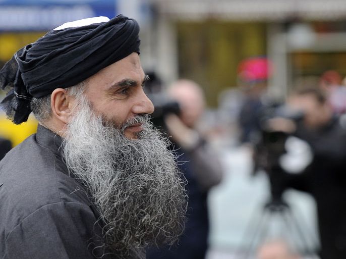 epa03469316 Muslim cleric Abu Qatada arrives at his home in north London after being freed on bail in London, Britain, 13 November 2012. Qatada has been freed on bail from Long Lartin prison in Worcestershire after a British court ruled he might not get a fair trial if deported to Jordan to face terrorism charges. EPA/ANDY RAIN