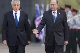 US Defence Secretary Chuck Hagel (L) and Israel's Defence Minister Moshe Yaalon review troops at the Hakirya military base on April 22, 2013 in Tel Aviv, Israel, before talks that were expected to focus on Syria's protracted civil war and Iran's disputed nuclear programme. Hagel, in his first visit to the Middle East since taking over as defence secretary two months ago, is also scheduled to take a helicopter tour of the Israeli-occupied Golan Heights on Syria's frontier, officials said. AFP PHOTO POOL ARIEL SCHALIT