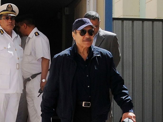 Former interior minister Habib al-Adly leaves the courtroom at the police academy after his trial, in Cairo April 13, 2013. Adli, former Egyptian President Hosni Mubarak and four top aides face a retrial for complicity in the murder of more than 800 protesters after the highest appeals court accepted appeals by both the defence and the prosecution in January. REUTERS/Stringer (EGYPT - Tags: POLITICS CRIME LAW)