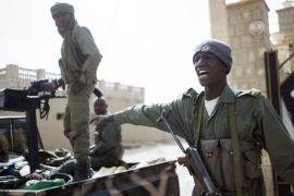 MALI : (FILES) In this photo dated on February 1, 2013 Malian soldiers patrol in the streets of Timbuktu.