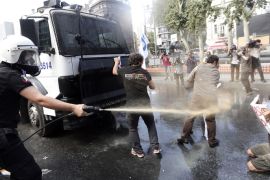 epa03724533 Turkish riot police use water to disperse demonstrators during a protest against the planned construction of a new shopping mall at Taksim Square in Istanbul, Turkey, 31 May 2013. Protesting under the slogan 'OccupyGezi', activists have been staging a demonstration since 28 May to save Taksim Square. EPA/SEDAT SUNA