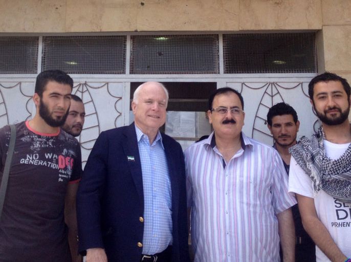 SYRIA : TOPSHOTSA handout picture released by the Syrian Emergency Task Force shows US Senator John McCain (C-L) posing for a picture with Syrian rebel leader General Salim Idris (C-R) and other members of the Syrian opposition in the Syrian border town of Bab al-Salam, near Turkey, on May 27, 2013. McCain crossed from Turkey into Syria to meet with rebel leaders in the war-torn nation, according to a spokesman for the top lawmaker who advocates arming the Syrian opposition. AFP PHOTO / MOUAZ MOUSTAFA / HO / SYRIAN EMERGENCY TASK FORCE