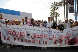 Women and children take part in a march against child abuse along the streets of Casablanca May 5, 2013. The banner reads: "paedophilia equals crime." REUTERS/Stringer (MOROCCO - Tags: CIVIL UNREST SOCIETY)