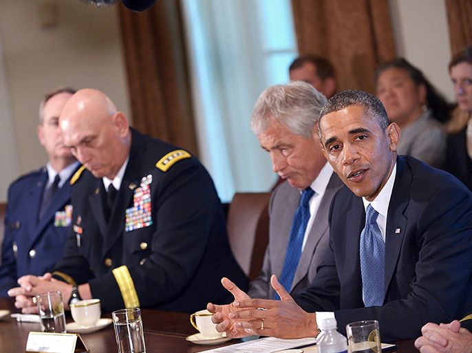 US President Barack Obama speaks following a meeting with US Defense Secretary Chuck Hagel (2nd R) and Chief of Staff of the Army Ray Odierno (2nd L) on 16 May, 2013 in the Cabinet Room of the White House in Washington, DC. Obama met with Hagel, service secretaries, and service chiefs to discuss sexual assault in the military. The US military vowed May 15 to address a wave of sexual assault cases after a soldier who worked in a rape prevention program was accused of forcing a subordinate into prostitution. The latest revelation marked the second time in a week that a member of the military assigned to work in its sexual assault prevention program had been placed under investigation for alleged sexual crimes. AFP PHOTO/Mandel NGAN