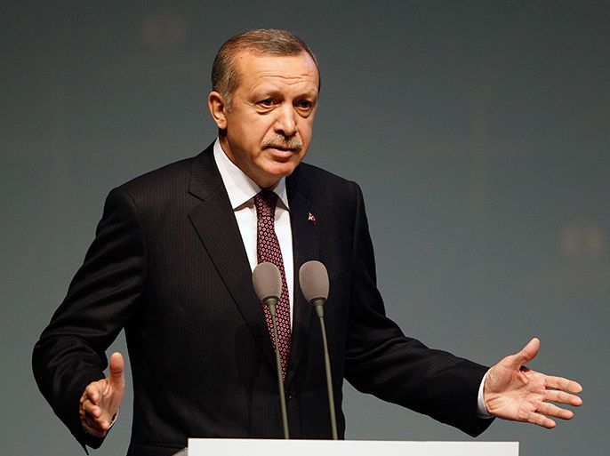 Turkey's Prime Minister Tayyip Erdogan address an audience during the European Bank for Reconstruction and Development's (EBRD) 2013 Annual Meeting and Business Forum in Istanbul May 10, 2013. Erdogan said Turkey would support a U.S.-enforced no-fly zone in Syria and warned that Damascus crossed President Barack Obama's "red line" on chemical weapons use long ago, according to an NBC News interview released Thursday. REUTERS/Osman Orsal (TURKEY - Tags: POLITICS BUSINESS)