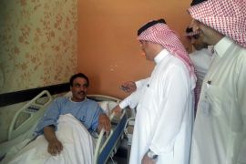 A Saudi health ministry official visits patients infected with a new SARS-like virus at a hospital in the eastern Saudi province of al-Ahsaa on May 13, 2013. Fifteen people in Saudi Arabia have died from the new Coronavirus (nCoV) out of 24 people who contracted it since last August, according to the health minister. AFP PHOTO/STR