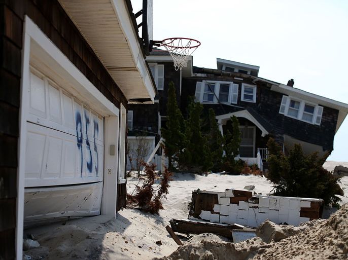 New Jersey, UNITED STATES : MANTOLOKING, NJ - MAY 15: A beach front home damaged by Superstorm Sandy is tagged to be torn down and hauled off, May 15, 2013 in Manotoloking, New Jersey. Mantoloking officials say that at least 50