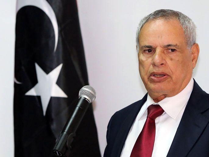 A file picture taken on November 27, 2012, shows Libya's Defence Minister Mohammed al-Barghathi speaking during a handover ceremony at the headquarters of the Libyan army chief of staff in Tripoli. Barghathi resigned due to a crisis caused by gunmen who have besieged two ministries for more than a week, a ministry official said.