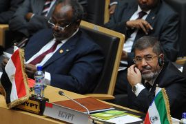 Egyptian President Mohamed Morsi (R) and his Djiboutian counterpart Mohammed Guelleh attend the 50th jubilee's ceremonies of the African Union, with Africa's myriad problems set aside for a day to mark the progress that has been made. AFP PHOTO/SIMON MAINA