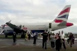 A still image taken from video shows passengers walking away from a British Airways passenger jet after it made an emergency landing at Heathrow Airport west of London May 24, 2013. The plane travelling from London to Oslo was forced to make an emergency landing at Heathrow on Friday after a technical fault in an engine. REUTERS