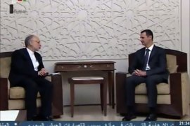 An image grab taken from the state-run Syrian television on May 7, 2013, shows Syrian President Bashar al-Assad (R) meeting with Iran's Foreign Minister Ali Akbar Salehi in Damascus. AFP PHOTO/HO/SYRIAN TV == RESTRICTED TO EDITORIAL USE - MANDATORY CREDIT "AFP PHOTO/SYRIAN TV - NO MARKETING NO ADVERTISING CAMPAIGNS - DISTRIBUTED AS A SERVICE TO CLIENTS ==