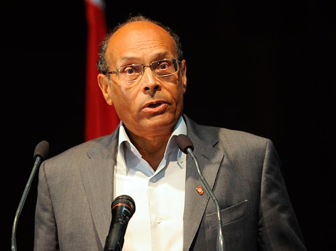 Tunisian President Monzef Marzouki gives his speech during a debate being held by the Tunisian employers union UTICA on reviving the country's ailing economy amid ongoing political instability and social unrest, on May 11, 2013, in Tunis. AFP PHOTO/FETHI BELAID