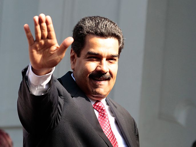 Venezuela's President Nicolas Maduro waves to the media after arriving for a meeting with his Uruguayan counterpart Jose Mujica at the Uruguayan presidential house in Montevideo May 7, 2013. REUTERS/Andres Stapff (URUGUAY - Tags: POLITICS)