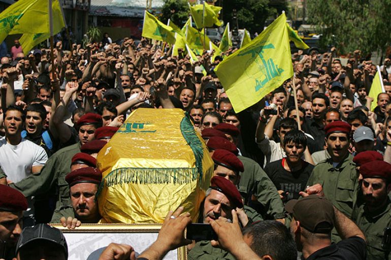 Members of Lebanon's Hezbollah carry the coffin of their comrade Hussein Ahmed Abul Hassan during his funeral in southern Beirut on May 21, 2013. Elite Hezbollah fighters poured across the border from Lebanon into Syria to lead a withering assault by President Bashar al-Assad's forces on the rebel stronghold of Qusayr, the Syrian Observatory for Human Rights reported. The Britain-based watchdog said at least 31 Hezbollah fighters have been killed in the battle for Qusayr since May 19, as well as 70 rebels, nine soldiers, three paramilitary fighters and four civilians. AFP PHOTO/STR