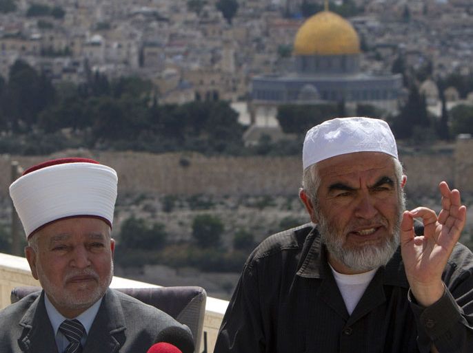 Arab-Israeli Islamist leader Sheikh Raed Salah (R) speaks as the Mufti of Jerusalem Mohammed Hussein listens on during a press conference in Jerusalem on May 16, 2013 during which he demanded for the protection of the Al-Aqsa Mosque compound (background), Islam's third holiest site, following clashes between Israel settlers and Palestinians earlier in the week