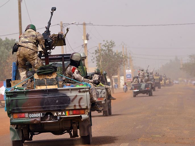 (FILES) This file picture taken on January 31, 2013 shows Niger troops from the African-led International Support Mission to Mali (AFISMA or MISMA) arriving in Gao, two days after the city was recaptured by French-led soldiers in a lightning offensive against radicals holding Mali's north. A kamikaze was killed during a suicide attack against a camp of Niger's army in Menaka, northeastern Mali, on early May 10, 2013, but there were no victims amongst Niger's troops. AFP PHOTO / SIA KAMBOU