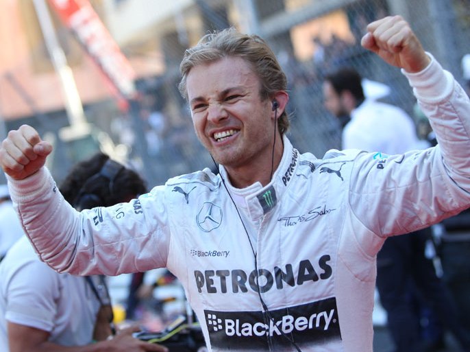 Mercedes' German driver Nico Rosberg celebrates winning at the Circuit de Monaco in Monte Carlo on May 26, 2013 after the Monaco Formula One Grand Prix. AFP PHOTO / JEAN-CHRISTOPHE MAGNENET