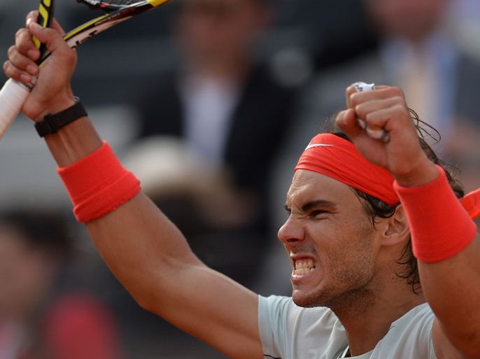 Spain's Rafael Nadal celebrates defeating Czech Republic's Tomas Berdych during their Rome Masters semi-finals tennis match on May 18, 2013. Nadal won 6-2, 6-4 to reach the final. AFP PHOTO / GABRIEL BOUYS