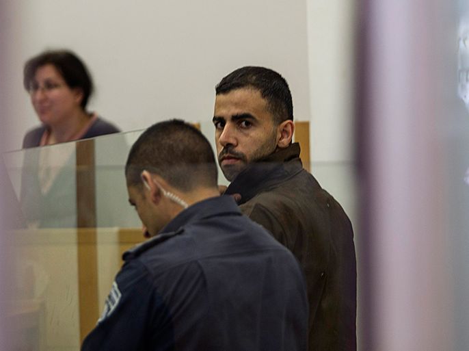 Hikmat Massarwa (R), a member of Israel's Arab minority, attends a remand hearing at the Central District Court in Lod, near Tel Aviv in this April 25, 2013 file photo. The dilemma Israel faces in trying to formulate a strategy on Syria two years into its civil war is symbolised by a case being heard in a small courtroom near Tel Aviv. The state is prosecuting Arab Israeli, Hikmat Massarwa, who briefly joined the rebel forces fighting to topple President Bashar al-Assad. To match story SYRIA-CRISIS/ISRAEL REUTERS/Baz Ratner/Files (ISRAEL - Tags: POLITICS CIVIL UNREST CRIME LAW)