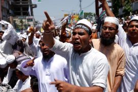 Supporters shout slogans while they attend a rally in the capital of Bangladesh after a long march from different parts of the country was organized by a radical Islamic group called Hefajat-e-Islamigroup, at Shapla Chattar in Dhaka, Bangladesh, 06 April 2013. The organization called for the march to demand action against 'atheists and blasphemous bloggers' of Shahbagh's Ganajagaran Mancha. EPA/ABIR ABDULLAH