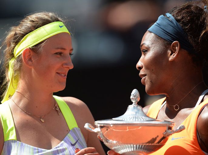US Serena Williams (R) and Belarusia's Victoria Azarenka celebrate with the trophies during the ceremony of the WTA Rome Masters on May 19, 2013. World number one Serena Williams beat Belarusia's Victoria Azarenka 6-1, 6-3 to win the Rome Open title. AFP PHOTO / FILIPPO MONTEFORTE