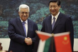 Beijing, -, CHINA : China's President Xi Jinping (R) shakes hands with his Palestinian counterpart Mahmoud Abbas during a signing ceremony at the Great Hall of the People in Beijing on May 6, 2013. Abbas will stay in China until May 7