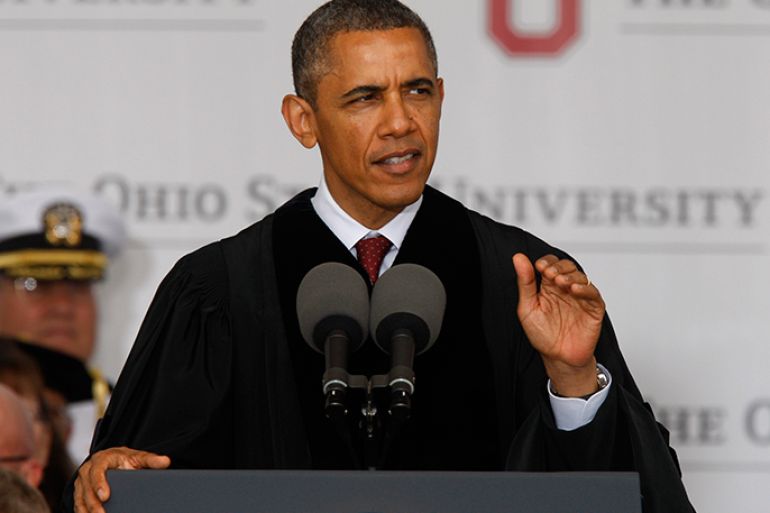 epa03688814 US President Barack Obama gestures as he delivers the commencement address to graduates at Ohio State University during ceremonies at Ohio Stadium in Columbus, Ohio, USA 05 May 2013. Obama told graduates "Look at all America has accomplished. Look how big we've been. I dare you to do better. I dare you to do better." EPA/PAUL VERNON