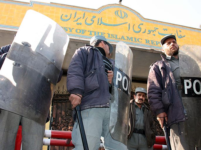 epa02522632 Afghan police stand guard during a protest in front of the Iranian Embassy in Kabul, Afghanistan on 10 January 2011. Hundreds of Afghans on 10 January demonstrated outside the Iranian embassy in Kabul to protest Iran's blocking of thousands of fuel trucks at the Afghan border, a move that has sent domestic fuel prices soaring as winter sets in. EPA/S. SABAWOON