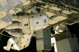 epa03696135 A handout video grabbed image made available by NASA TV showing US astronauts, flight engineers Chris Cassidy and Tom Marshburn from USA during spacewalk at the International Space Station, 11 May 2013. The astronauts aboard the International Space Station conducted a spacewalk to fix a leak discovered in the spaceship's cooling system, NASA reported. Mission managers spent the day 10 May reviewing data on the leak,
